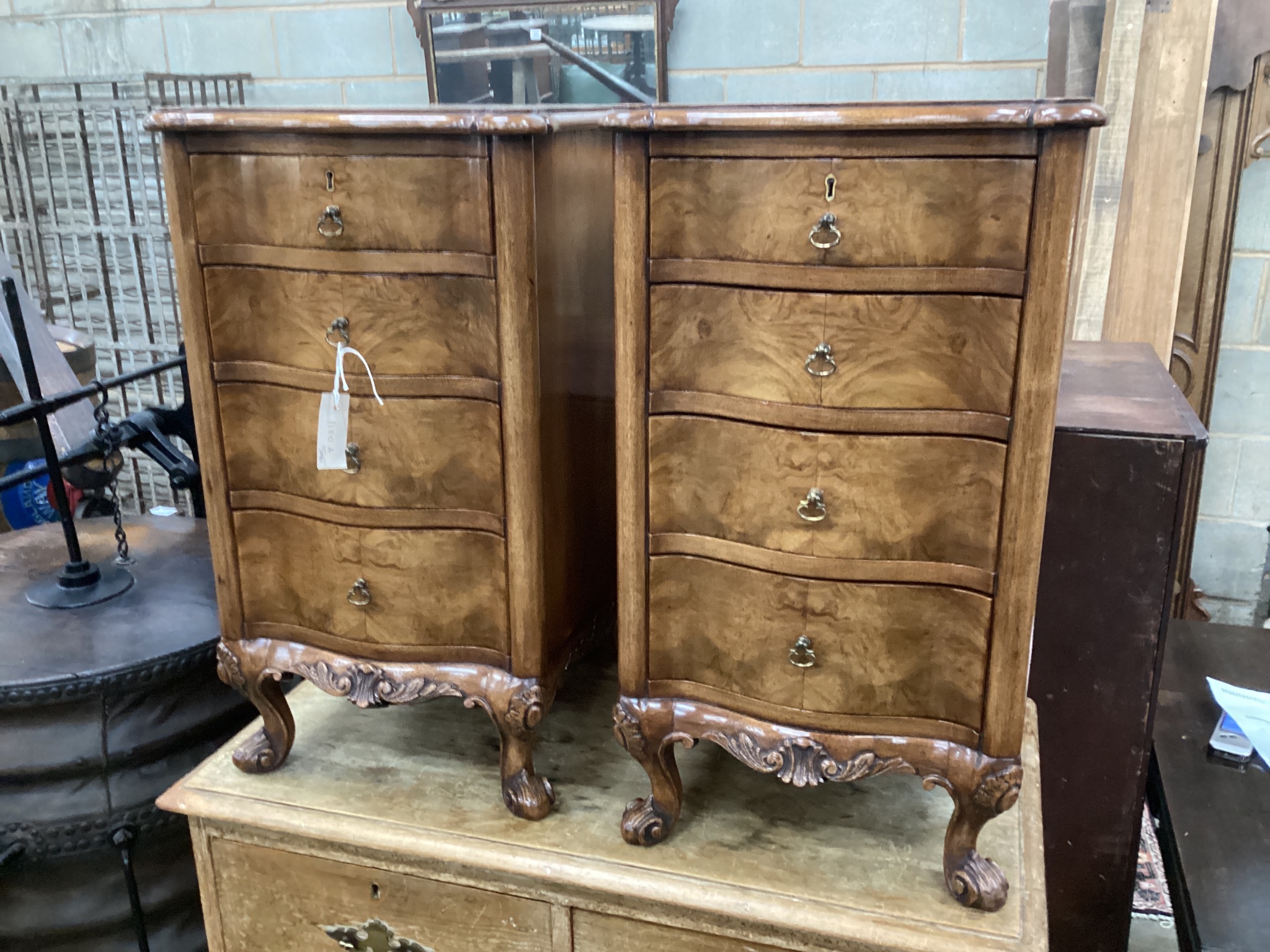 A pair of Queen Anne revival walnut serpentine four drawer bedside chests, width 38cm, depth 43cm, height 70cm